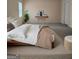 Relaxing bedroom featuring a comfortable bed, warm decor, and natural light from the window at 110 Vicarage Ct, Johns Creek, GA 30005