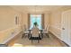 Cozy dining room with hardwood floors, neutral walls, and elegant light fixture at 110 Vicarage Ct, Johns Creek, GA 30005