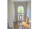 Expansive two-story foyer with hardwood floors and a large arched window at 110 Vicarage Ct, Johns Creek, GA 30005