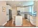 Bright kitchen showcasing a center island, stainless appliances, and custom cabinetry at 110 Vicarage Ct, Johns Creek, GA 30005