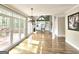 Open-concept living room boasts hardwood floors, fireplace, and access to an outdoor deck at 110 Vicarage Ct, Johns Creek, GA 30005