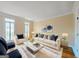 Bright living room with plush rug, stylish furniture, and natural light at 110 Vicarage Ct, Johns Creek, GA 30005
