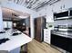 Modern kitchen featuring stainless steel appliances, breakfast bar with seating, open layout, and stylish decor at 120 Williamsburg Way, Fayetteville, GA 30214
