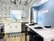 Open-concept kitchen with white cabinets, breakfast bar seating, stainless steel appliances, and eat-in area at 120 Williamsburg Way, Fayetteville, GA 30214