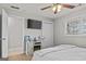 Spare bedroom with a white and grey color palette, ceiling fan and decorative fireplace at 4739 Lower Jersey Rd, Oxford, GA 30054