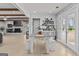 Dining area with rustic table and bench seating with shiplap walls and access to covered patio at 4739 Lower Jersey Rd, Oxford, GA 30054