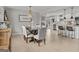 Open-concept dining room with a stylish chandelier and seamless flow to the kitchen at 4739 Lower Jersey Rd, Oxford, GA 30054