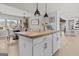 Bright kitchen with stainless steel appliances, white cabinets, and butcher block countertops at 4739 Lower Jersey Rd, Oxford, GA 30054