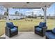 Relaxing patio view overlooking the expansive backyard and outdoor fire pit at 4739 Lower Jersey Rd, Oxford, GA 30054