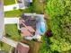 Aerial view of property showcasing in-ground swimming pool, patio, and lush landscaping at 3707 Lance Bluff Ln, Duluth, GA 30097