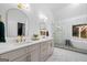 Bright bathroom with double vanity, marble floors, shower, and soaking tub at 3707 Lance Bluff Ln, Duluth, GA 30097