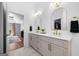Bathroom with double vanity, marble floors, and bedroom view at 3707 Lance Bluff Ln, Duluth, GA 30097