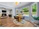 Charming breakfast nook features great views of the backyard pool, hardwood floors and recessed lighting at 3707 Lance Bluff Ln, Duluth, GA 30097