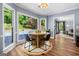Bright breakfast nook with natural light, hardwood floors and views of the backyard pool at 3707 Lance Bluff Ln, Duluth, GA 30097