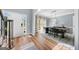 Bright dining room features an elegant light fixture, modern table setting and beautiful hardwood floors at 3707 Lance Bluff Ln, Duluth, GA 30097