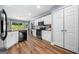 Kitchen featuring stainless steel appliances, white cabinets, and granite countertops at 3707 Lance Bluff Ln, Duluth, GA 30097