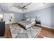 Spacious main bedroom with hardwood floors, neutral walls, and ceiling fan at 3707 Lance Bluff Ln, Duluth, GA 30097