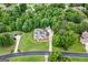 Spacious property featuring lush greenery, mature trees, a pool, and a well-maintained home at 604 Clearwater Ct, Mcdonough, GA 30252