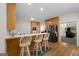 Traditional eat-in kitchen features stainless steel appliances, wooden cabinetry, and breakfast bar with seating at 604 Clearwater Ct, Mcdonough, GA 30252