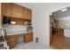 Spacious laundry room featuring ample cabinets, a large desk area, tile floors, and neutral paint at 604 Clearwater Ct, Mcdonough, GA 30252