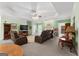 Spacious living room with tray ceilings, fireplace, and comfortable seating at 604 Clearwater Ct, Mcdonough, GA 30252