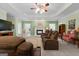 Inviting living room with fireplace, plush seating, and green walls at 604 Clearwater Ct, Mcdonough, GA 30252