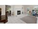 Bright sunroom with tile flooring, fireplace, and access to other living spaces at 604 Clearwater Ct, Mcdonough, GA 30252