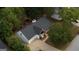 Aerial view of the home showcases a covered front porch and mature trees creating a sense of privacy at 70 Summer Walk Dr, Covington, GA 30016