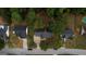 Aerial view of the backyard features mature trees in a quiet neighborhood at 70 Summer Walk Dr, Covington, GA 30016
