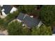 Overhead shot shows this charming home with a well-manicured lawn and mature trees at 70 Summer Walk Dr, Covington, GA 30016
