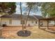 Spacious backyard featuring a pergola, fire pit, grill, and well-maintained lawn at 70 Summer Walk Dr, Covington, GA 30016