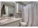 Bathroom showcasing a vanity sink, medicine cabinet, toilet, and shower/tub combination with white shower curtain at 70 Summer Walk Dr, Covington, GA 30016