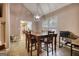 Cozy dining area with a view of the kitchen and a stylish pendant light fixture at 70 Summer Walk Dr, Covington, GA 30016
