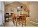 Spacious dining area with vaulted ceiling and a view of living room, adjacent to home office setup at 70 Summer Walk Dr, Covington, GA 30016