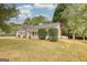 Charming home featuring a well-manicured lawn, established landscaping, and an inviting front porch for relaxation at 70 Summer Walk Dr, Covington, GA 30016