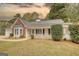 Charming one-story home with white siding, brick accents, and a welcoming front porch at 70 Summer Walk Dr, Covington, GA 30016