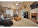 Bright living room with fireplace, vaulted ceilings, and view of bedroom and dining area at 70 Summer Walk Dr, Covington, GA 30016