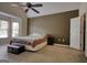 Main bedroom with large window, ceiling fan, and ensuite at 70 Summer Walk Dr, Covington, GA 30016