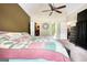 Spacious main bedroom features a ceiling fan, closet, and neutral carpet at 70 Summer Walk Dr, Covington, GA 30016