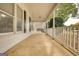 Inviting covered porch with swing and white railing, perfect for relaxing outdoors at 70 Summer Walk Dr, Covington, GA 30016