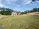 Expansive backyard, newly seeded with lush lawn, perfect for enjoying outdoor activities and relaxation at 1465 Leach Dr, Lawrenceville, GA 30045