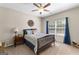Comfortable bedroom with a large window, neutral walls, and carpeted flooring at 71 Pacific Ave, Sharpsburg, GA 30277