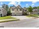 Charming two-story home featuring a three-car garage, well-manicured lawn, and inviting curb appeal at 71 Pacific Ave, Sharpsburg, GA 30277
