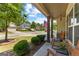 Charming front porch featuring rocking chairs, an American flag, and a beautiful view of the neighborhood at 71 Pacific Ave, Sharpsburg, GA 30277
