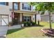 Inviting front porch with rocking chairs and manicured landscaping adds charm to this lovely home at 71 Pacific Ave, Sharpsburg, GA 30277