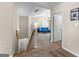 Upstairs hallway leading to a living area, features carpeted floors and neutral paint at 71 Pacific Ave, Sharpsburg, GA 30277