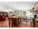 Open kitchen featuring a large island, granite countertops, and stainless steel appliances at 71 Pacific Ave, Sharpsburg, GA 30277