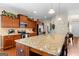 Spacious kitchen featuring granite countertops, stainless steel appliances, and ample wooden cabinet space at 71 Pacific Ave, Sharpsburg, GA 30277