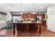 The kitchen features stainless appliances, a kitchen island, and hardwood floors at 71 Pacific Ave, Sharpsburg, GA 30277