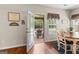 Eat-in kitchen with a door to the porch, stainless appliances, and hardwood floors at 71 Pacific Ave, Sharpsburg, GA 30277